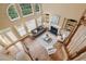 High-angle view of a bright living room with a fireplace and large windows, showing the layout and hardwood floors at 340 Old York Rd, Johns Creek, GA 30097