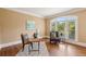 Cozy home office offers a comfortable seating area and natural light at 340 Old York Rd, Johns Creek, GA 30097