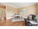 Cozy home office offers hardwood floors and a comfortable seating area at 340 Old York Rd, Johns Creek, GA 30097