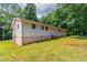 Expansive backyard with lush green grass and mature trees at 6293 Silver Creek Ln, Austell, GA 30168