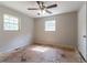 This bedroom features a ceiling fan and two windows, providing ample light and ventilation at 6293 Silver Creek Ln, Austell, GA 30168