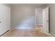 Standard bedroom featuring neutral grey walls and a doorway at 6293 Silver Creek Ln, Austell, GA 30168