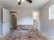 Bedroom needing remodeling with easy access to an ensuite bath via an open doorway at 6293 Silver Creek Ln, Austell, GA 30168