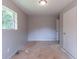 Standard bedroom featuring neutral grey walls, a window, and a closet at 6293 Silver Creek Ln, Austell, GA 30168