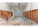 Spacious garage with a metal door and exposed wall studs at 6293 Silver Creek Ln, Austell, GA 30168