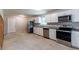 Modern kitchen featuring white cabinets, stainless steel appliances, and granite countertops at 6293 Silver Creek Ln, Austell, GA 30168
