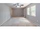 Spacious living room with ample natural light, grey walls, and access to an outdoor porch at 6293 Silver Creek Ln, Austell, GA 30168