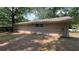 Backyard view of a tan brick home, showing the back exterior of the house at 1026 Eisenhower Se Ct, Atlanta, GA 30354