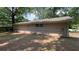 The backyard of the house has green trees surrounding the property at 1026 Eisenhower Se Ct, Atlanta, GA 30354