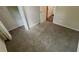 Comfortable bedroom with carpeted floors, neutral paint, and good lighting at 1026 Eisenhower Se Ct, Atlanta, GA 30354