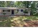 Charming single-story home with a well-maintained front yard, and brick accents at 1026 Eisenhower Se Ct, Atlanta, GA 30354