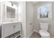 Well-lit bathroom with a vanity, new fixtures, and a neutral color scheme at 1192 Melton Sw Dr, Lilburn, GA 30047