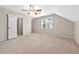Bedroom showing carpet flooring, a window with blinds, and a ceiling fan at 1192 Melton Sw Dr, Lilburn, GA 30047