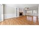 Cozy living room with a brick fireplace, built-in shelves, hardwood floors, and access to the patio at 1192 Melton Sw Dr, Lilburn, GA 30047