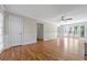 Spacious living room with hardwood floors, crown molding, and a large window with natural light at 1192 Melton Sw Dr, Lilburn, GA 30047
