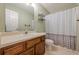Standard bathroom with a vanity, toilet, shower-tub, and basic fixtures at 2563 Creek Ter, Snellville, GA 30078