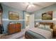 Stylish bedroom with a bed, dresser, two-toned walls, and a themed accent at 2563 Creek Ter, Snellville, GA 30078