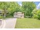 Charming two-story home with a well-manicured lawn and a double car garage, set in a lush green surrounding at 2563 Creek Ter, Snellville, GA 30078