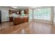 Eat-in kitchen featuring wood cabinets, island, and lots of natural light at 2563 Creek Ter, Snellville, GA 30078