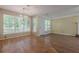 Spacious living room with hardwood floors, a fireplace, and lots of natural light at 2563 Creek Ter, Snellville, GA 30078