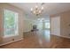 Bright living room featuring hardwood floors, a fireplace, and large windows at 2563 Creek Ter, Snellville, GA 30078