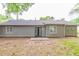 Back exterior of home with double door, flat roof, neutral paint, and windows at 4164 Little Nw Spgs, Kennesaw, GA 30144