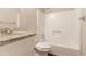 This bathroom has a vanity, toilet, and shower/tub combination at 4164 Little Nw Spgs, Kennesaw, GA 30144