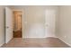 A bedroom featuring neutral colored walls with carpet flooring and two white doors at 4164 Little Nw Spgs, Kennesaw, GA 30144