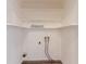 A laundry room with white walls, laminate flooring, and shelving at 4164 Little Nw Spgs, Kennesaw, GA 30144