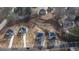 Aerial view of new home construction project with homes, driveways, and surrounding topography at 4420 Ross Estates Ct, Snellville, GA 30039