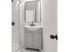 Bathroom features modern sink with vanity and walk-in shower with glass door at 4420 Ross Estates Ct, Snellville, GA 30039