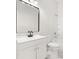 Modern bathroom featuring a black faucet, white cabinets, and a clean, contemporary design at 4420 Ross Estates Ct, Snellville, GA 30039