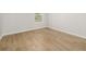 Bright bedroom with hardwood floors and a view from the window at 4420 Ross Estates Ct, Snellville, GA 30039