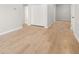 Bedroom features wood-style flooring, neutral paint, and a closet with bi-fold doors at 4420 Ross Estates Ct, Snellville, GA 30039