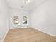 Bright bedroom with hardwood floors and abundant natural light from large windows at 4420 Ross Estates Ct, Snellville, GA 30039