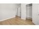 Bedroom featuring hardwood flooring, a closet, and white doors at 4420 Ross Estates Ct, Snellville, GA 30039