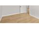 Bright bedroom featuring new light wood flooring and fresh neutral paint throughout at 4420 Ross Estates Ct, Snellville, GA 30039