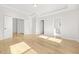 Bright bedroom with hardwood floors, walk-in closet, and ensuite bathroom at 4420 Ross Estates Ct, Snellville, GA 30039