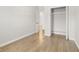 A bedroom featuring hardwood floors, white trim, and a closet at 4420 Ross Estates Ct, Snellville, GA 30039