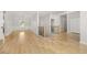 View of the home's light filled entryway, staircase and formal dining area at 4420 Ross Estates Ct, Snellville, GA 30039