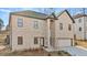 Beautiful two-story house featuring an attached two-car garage, elegant brickwork and an inviting entrance at 4420 Ross Estates Ct, Snellville, GA 30039