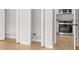 Open cabinets in kitchen offer lots of storage space at 4420 Ross Estates Ct, Snellville, GA 30039