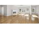 Light and bright living room features hardwood floors, modern fireplace and french doors at 4420 Ross Estates Ct, Snellville, GA 30039