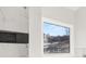 Close up of marble shower tile with dark accent stripe and window view of neighborhood at 4420 Ross Estates Ct, Snellville, GA 30039