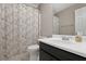 Cozy bathroom featuring a toilet, vanity with a sink, and a shower with a curtain at 64 Harbour Lake Dr, Fayetteville, GA 30215