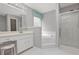 Bright bathroom features a shower, soaking tub, large vanity, and decorative window at 64 Harbour Lake Dr, Fayetteville, GA 30215