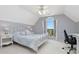 Bedroom with vaulted ceiling and a large window next to the desk area at 64 Harbour Lake Dr, Fayetteville, GA 30215