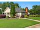 A well-maintained community building sits on a manicured lawn at 64 Harbour Lake Dr, Fayetteville, GA 30215