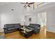 Spacious living room featuring hardwood floors, a high ceiling, and a ceiling fan at 64 Harbour Lake Dr, Fayetteville, GA 30215