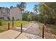 A paved walking path bordered by trees leads to a neighborhood home at 64 Harbour Lake Dr, Fayetteville, GA 30215